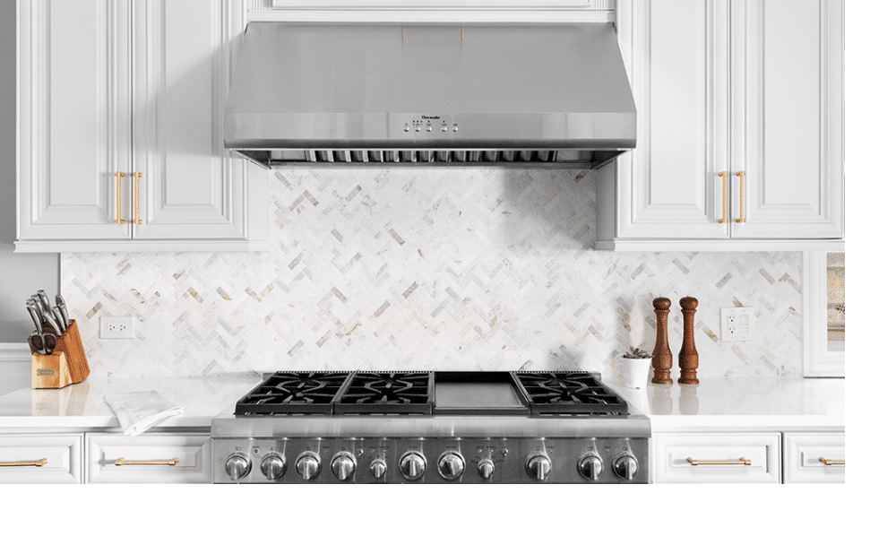 thermador-new2 bright white kitchen featuring stainless steel range and vent hood